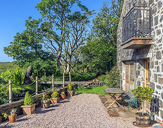 Photo of the outside of the Old Mill showing the balcony